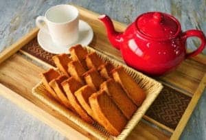 cake rusk with team pot and tea cup